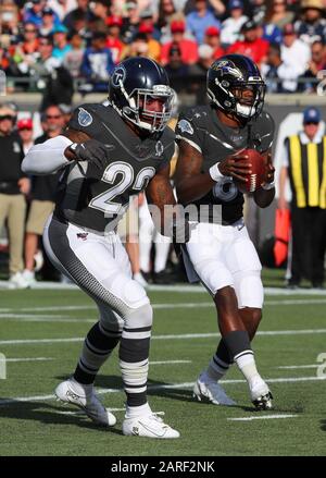Baltimore Ravens running back Derrick Henry (22) is tackled by Atlanta ...