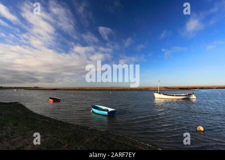 View over the boats in Burnham Overy Staithe Quay, North Norfolk, England, UK Stock Photo