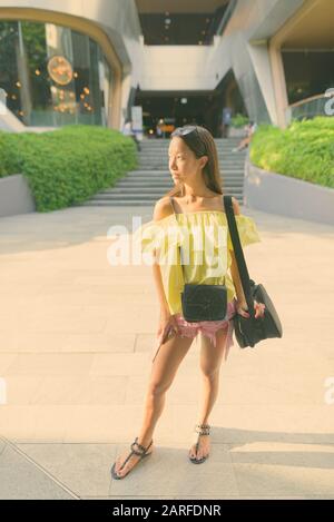 Young beautiful tourist woman exploring the city Stock Photo
