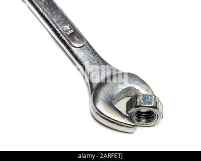 Wrench with nut isolated on white background Stock Photo
