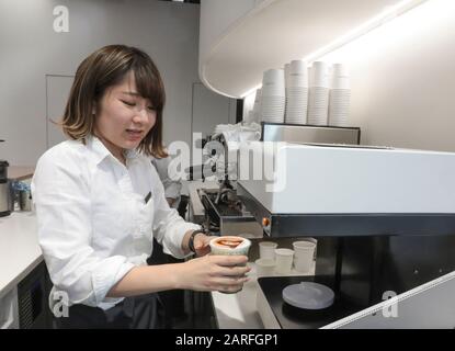MACCHI-ART  PRINTS YOUR FACE ON A CAFE Stock Photo