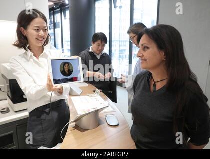 MACCHI-ART  PRINTS YOUR FACE ON A CAFE Stock Photo