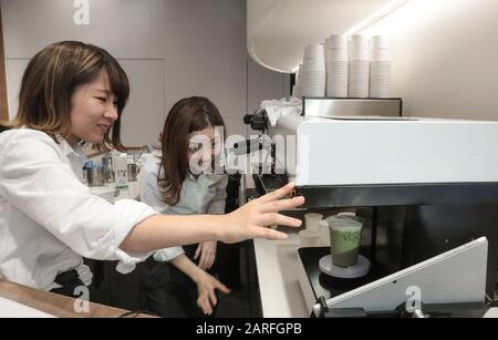 MACCHI-ART  PRINTS YOUR FACE ON A CAFE Stock Photo