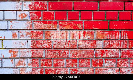 Wall stained with bright red and white paint Stock Photo
