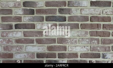 brick wall background in neutral brown tones Stock Photo