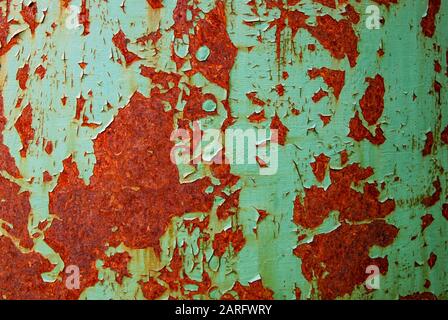 Oxidized iron wall with rust and pilled off green paint Stock Photo