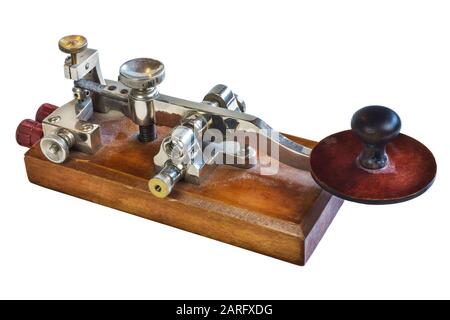 Ancient morse code telegraphy device isolated on a white background Stock Photo