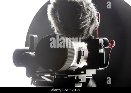 Digital camera with video microphone mounted on a gimbal. Youtuber streaming gear. Stock Photo