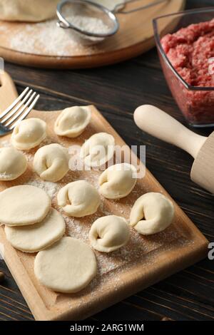 Composition with minced meat and dumplings on wooden background, close up Stock Photo