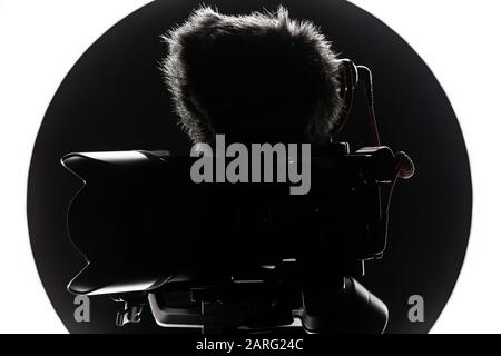 Digital camera with video microphone mounted on a gimbal. Youtuber streaming gear. Stock Photo