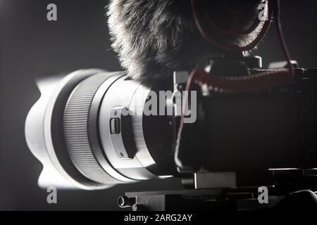 Digital camera with video microphone mounted on a gimbal. Youtuber streaming gear. Stock Photo