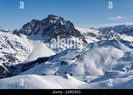 Mountains and ski runs above Meribel Mottaret in the Three Valleys ski area in France. Stock Photo