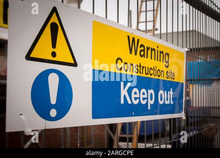Warning Construction site Keep Out sign attached to metal fencing Stock Photo