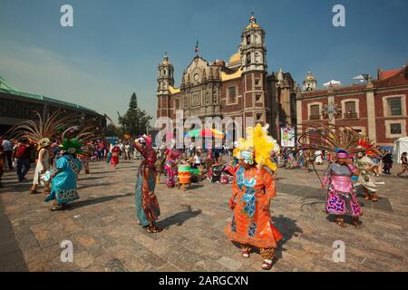 Virgen de Guadalupe with american an mexican flags Stock Photo - Alamy