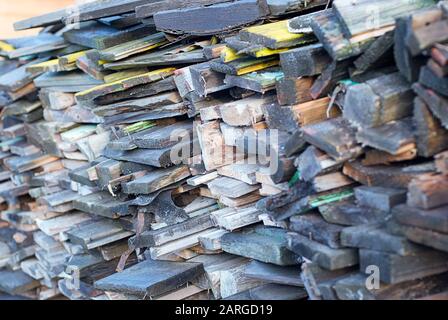 Stack of wooden boards from the dismantled house Stock Photo