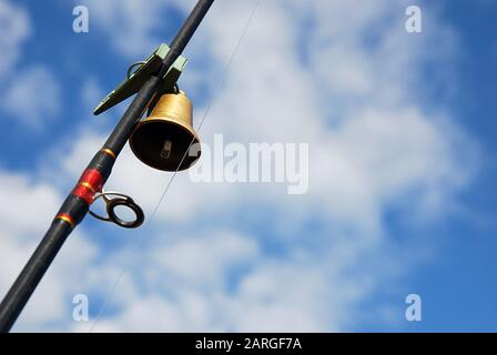 Russian Valdai bell fixed with clothespin on leger rig fishing rod