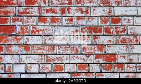 Grunge red brick wall background with white plaster stains Stock Photo