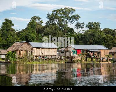 A small fishing community on Rio El Dorado, Amazon Basin, Loreto, Peru, South America Stock Photo