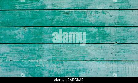 Old wood faded background painted in blue-green color Stock Photo