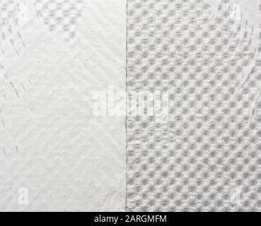 fragment of white tattered wrapping paper, full frame, close up Stock Photo