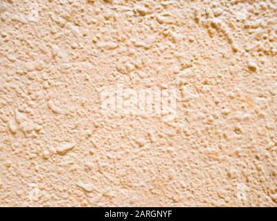 Abstract pink background texture concrete wall . the pink texture of the surface of the wall covered with decorative plaster of the woodworm type, clo Stock Photo