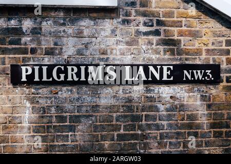 Pilgrims Lane name sign, Hampstead, London. A street name sign is a type of traffic sign used to identify named roads Stock Photo