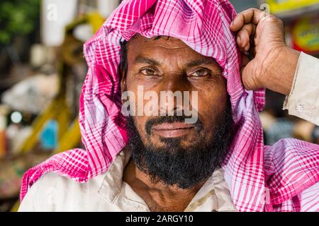 A portrait of a cycle rickshaw driver, waiting for customers Stock Photo