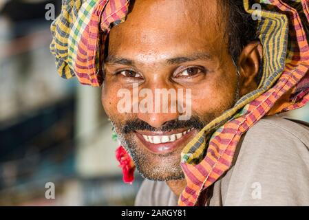 A portrait of a cycle rickshaw driver, waiting for customers Stock Photo