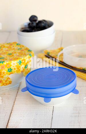 Bowls of food covered with a sustainable, re-usable silicone lid and beeswax wrap. Stock Photo