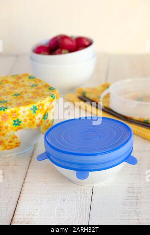 Bowls of food covered with a sustainable, re-usable silicone lid and beeswax wrap. Stock Photo