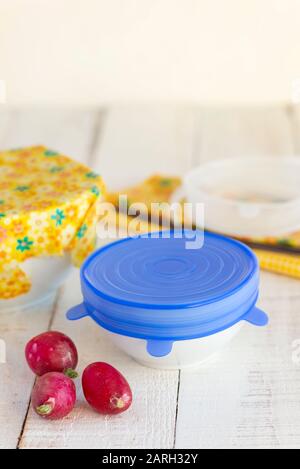 Bowls of food covered with a sustainable, re-usable silicone lid and beeswax wrap. Stock Photo