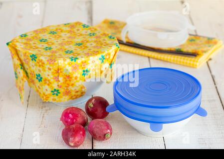 Bowls of food covered with a sustainable, re-usable silicone lid and beeswax wrap. Stock Photo