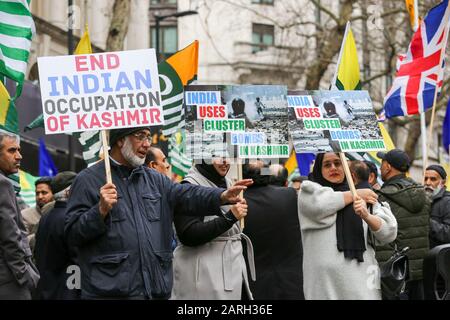 Protesters hold placard during the demonstration.Hundreds of Muslims, Kashmiris and Sikhs demonstrate outside an Indian High Commission calling for Kashmir to be free from India. Stock Photo
