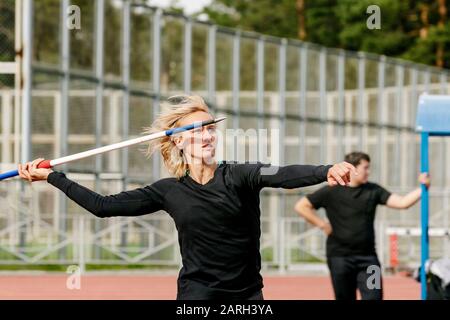 women athlete thrower javelin throw in athletics Stock Photo