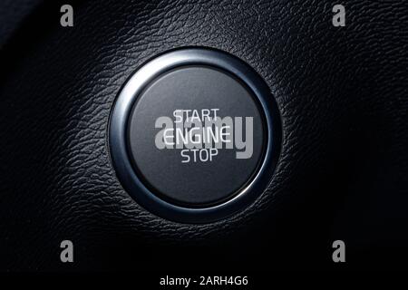 Push button starter in a car. Start engine with the press of this button. Stop engine with a press of this button. Stock Photo