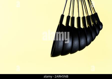 Set of black plastic measuring spoons, for cooking and baking. Stock Photo