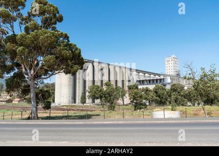 Caledon, Western Cape, South Africa. Dec 2019.  Large concrete grain silos on the edge of this town, located in the Overberg region. Stock Photo