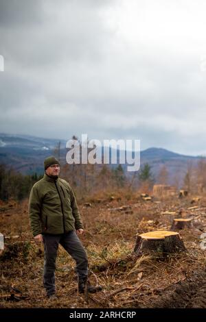 28 January 2020, Saxony-Anhalt, Wernigerode: Michael Selmikat, district forester of the city of Wernigerode, stands on the Armeleuteberg on a clearing area. The trees had died after two years of drought and because of the bark beetle and had been felled. The spruces are now used to produce pulp and wood for pallets. Some of it even goes to China as construction timber. The forest inspection in the city forest of Wernigerode took place on the edge of the "Forest Generation Dialogue". The organizer is the Schutzgemeinschaft Deutscher Wald Bundesverband (SDW). At the conference, young adults will Stock Photo