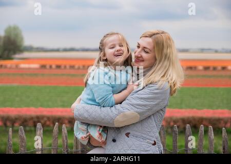 Mother and daughter laughing in Keukenhof park. Netherlands Stock Photo