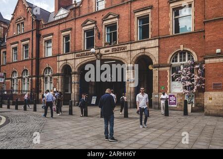 London/UK - 22/07/2019: people walking past the main entrance to Marylebone station. Marylebone was the last of London's main line termini to be built Stock Photo