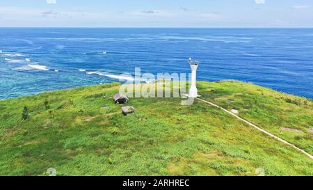 Lighthouse on a tropical island, top view. Beautiful landscape with a green island. Summer and travel vacation concept. Basot Island, Caramoan, Camarines Sur, Philippines. Stock Photo