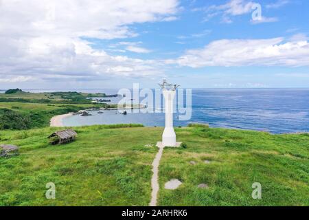 Lighthouse on a tropical island, top view. Beautiful landscape with a green island. Summer and travel vacation concept. Basot Island, Caramoan, Camarines Sur, Philippines. Stock Photo