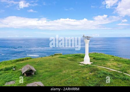 Basot Island, Caramoan, Camarines Sur, Philippines. Lighthouse on a hill by the sea, view from above . Beautiful landscape with a green island. Summer and travel vacation concept. Stock Photo