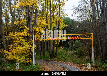 Village car park with maximum headroom barrier Stock Photo