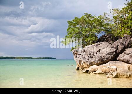 Large limestone rocks on Bagieng Island beach in the municipality of Caramoan, Camarines Sur Province, Luzon in the Philippines. Summer and travel vacation concept. Stock Photo