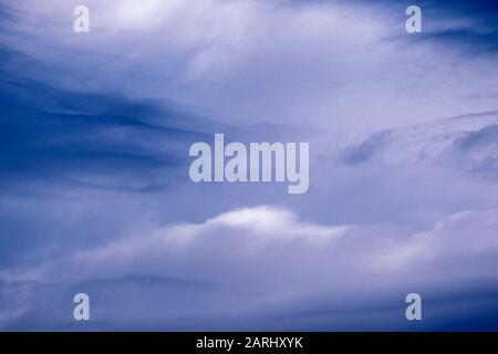 Background of Beautiful soft clouds against the perfect blue sky Stock Photo