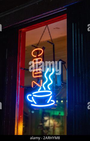 "Open" neon sign in a cafe window Stock Photo