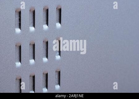 The grille on the metal surface close up, copy space Stock Photo
