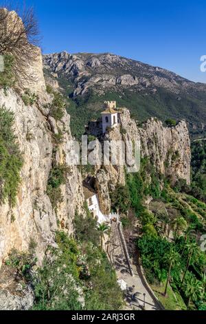 View of medieval enclosed mountain fortification El castell de Guadalest popular tourist destination near Benidorm and Alicancte in Spain Stock Photo