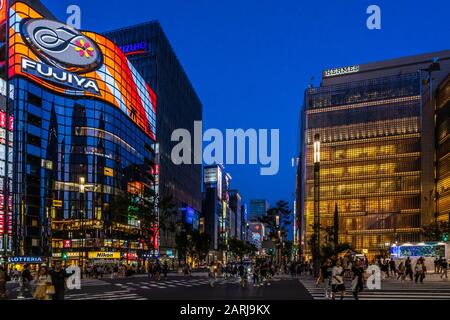 Night view of  Sukiyabashi crossing in Ginza. Ginza is considered one of the most expensive and luxury shopping districts in the world, Tokyo Stock Photo